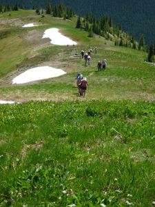 "Snow Camp": our group passing scattered snow at one of the summits in July.